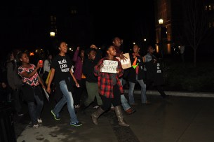 Me, Desiree Houston, Lakeisha St. Joy, and Jasmine Jemeison march in a non-violent protest at Boston College. Photo Cred: Emily Fahey/BC Heights